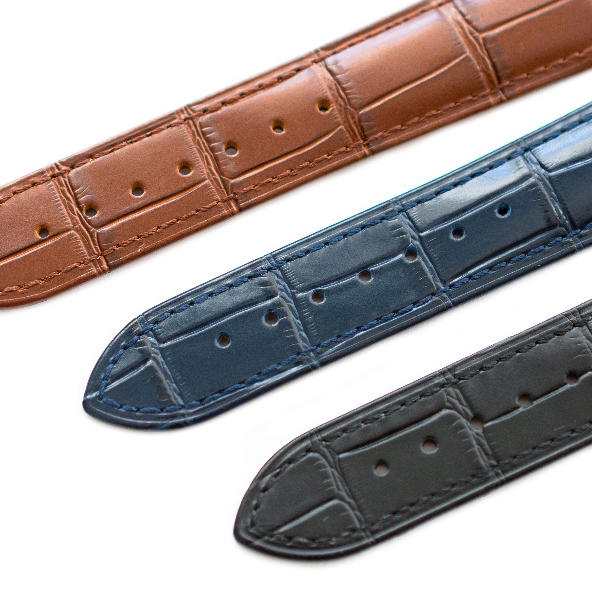 omega straps black blue brown closeup