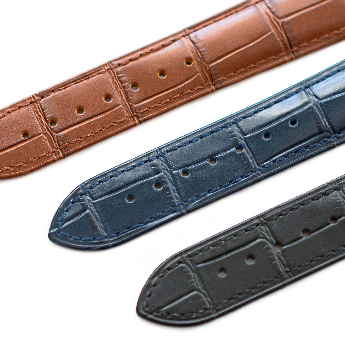 omega straps black blue brown closeup